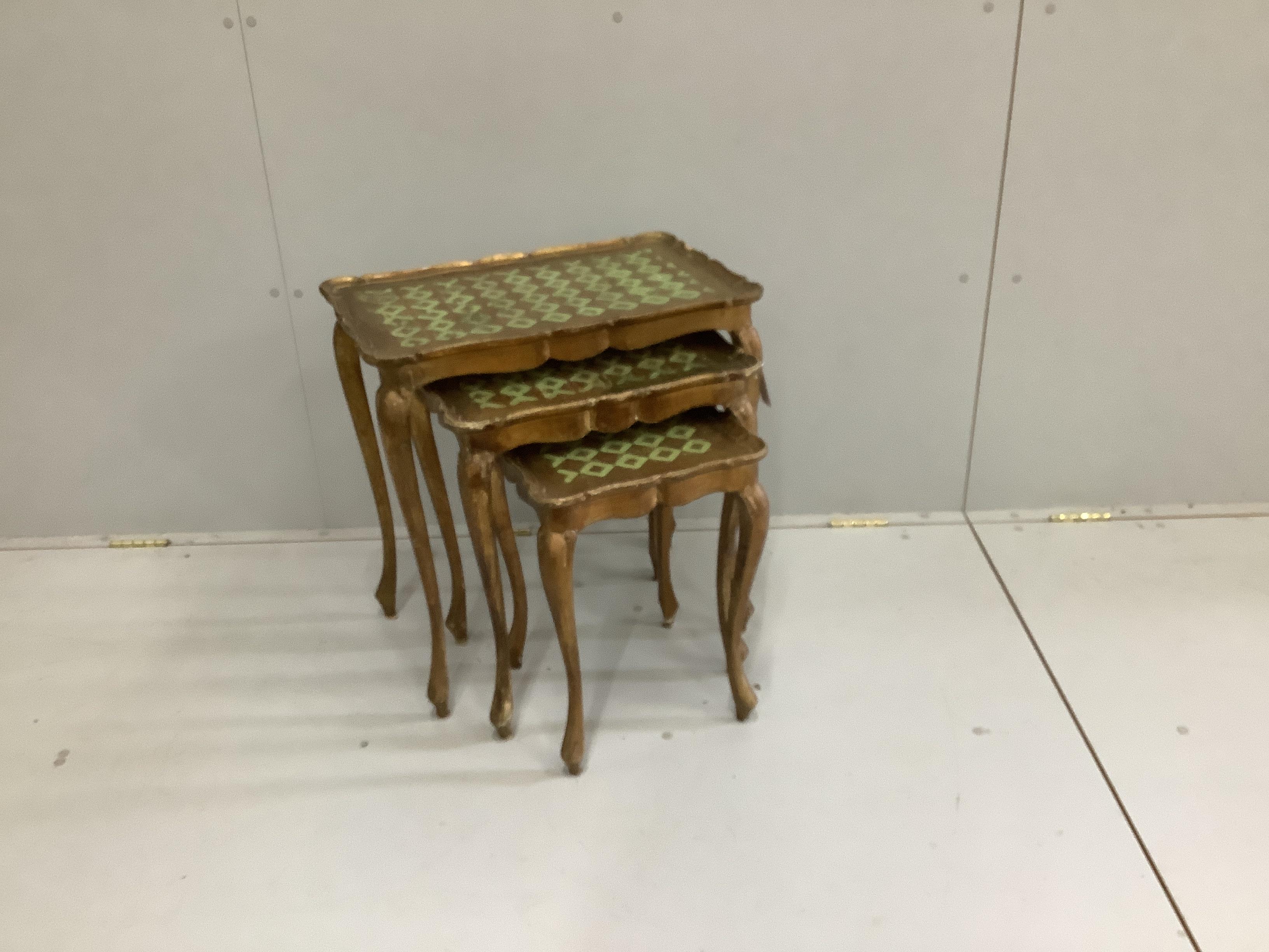 A nest of three Italian giltwood tea tables, width 56cm, depth 36cm, height 58cm